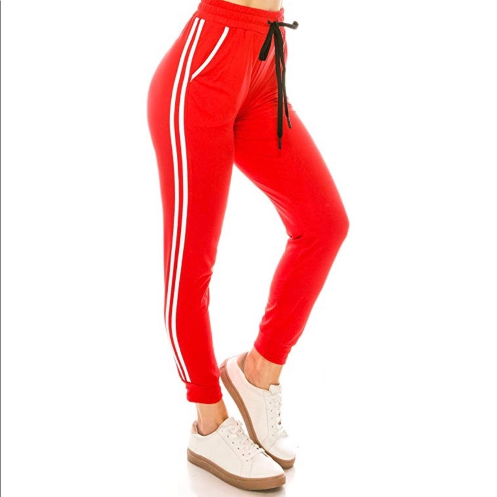Red joggers with white stripes